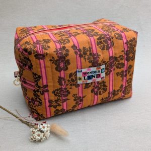 Grande trousse de toilette matelassée en tissu pour transporter les produits de beauté et de soin