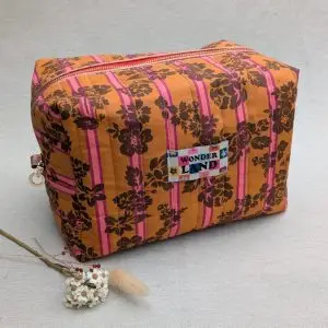 Grande trousse de toilette matelassée en tissu pour transporter les produits de beauté et de soin